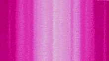 a cartoon character is laying on a pink background .