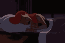 a woman with red hair is laying on a bed with a pillow .