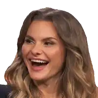 a close up of a woman 's face laughing with her mouth open