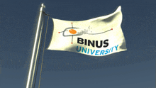 a white flag that says binus university is waving in the wind