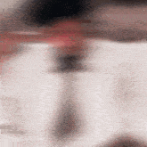 a blurred image of a person 's face with a few lines visible