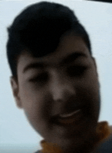 a close up of a person 's face with a smile on it .