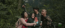 a group of people are hugging in the woods with the words project exit on the bottom right