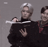 a man is reading a death note book
