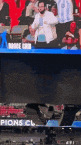 a man is dancing in the stands at a soccer game and the words dance cam are on the screen