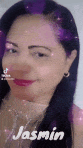 a woman with long black hair and the name jasmin on her face .