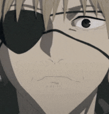 a close up of a person 's face with an eye patch on