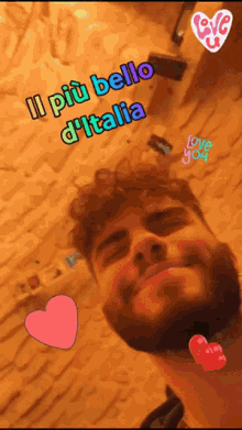 a man with a beard is smiling with the words " il più bello d' italia " above his head