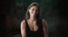 a woman in a black tank top with the name kayleigh on the bottom
