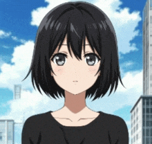 a girl with short black hair is wearing a black top
