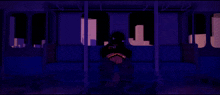 a person sits on a couch in a dark room with a purple background