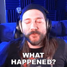 a man wearing headphones says " what happened " with his eyes closed
