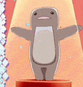 a cartoon penguin is standing on a red pedestal