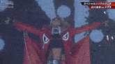 a woman in a red jacket with the letter d on the front