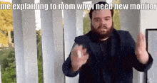 a man with a beard is explaining to his mother why he needs a new monitor