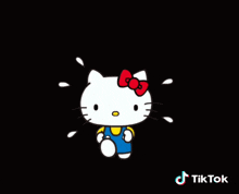 a cartoon of hello kitty with a red bow