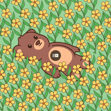 a teddy bear laying in a field of flowers