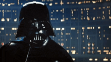 darth vader is standing in front of a screen that says ' i ' on it