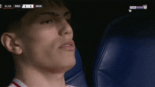 a close up of a man 's face with the score of 1 to 1