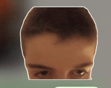 a close up of a man 's face with a white border around it
