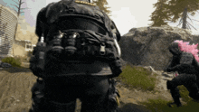 a soldier in a video game with a pink helmet