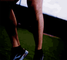 a close up of a person 's legs with the word demivan on the bottom left