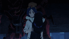 a girl is hugging a boy in front of a robot