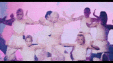 a group of female dancers are performing in front of a screen that says ' scents ' on it