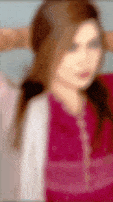 a blurry picture of a girl with long hair