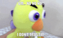 a person is holding a stuffed animal that says " um no no no i don 't trust it "