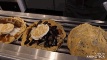 a bunch of sandwiches are on a tray with the words made in animotica on the bottom