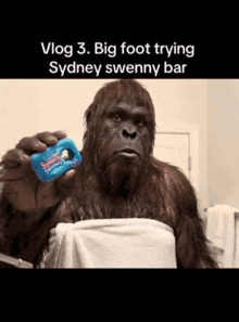 a sydney sweenny bar is being held by a big foot