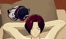 a person with red hair is laying on a bed with their eyes closed