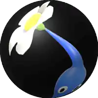 a black sphere with a white flower and a blue worm on it