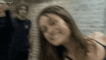 a blurry picture of a woman with the words margaritogif written on the bottom
