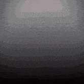 a dark background with a light coming out of the center