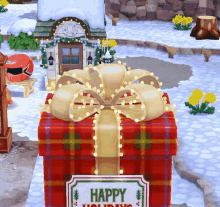 a red gift box with a bow and a happy holidays sign