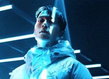 a man wearing a jacket with the word dynafit on the front