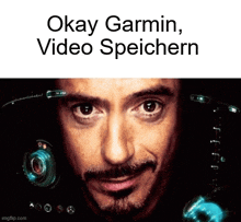 a close up of a man 's face with the words okay garmin video speichern above him