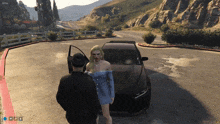 a woman in a blue dress is standing next to a man in a black jacket in a video game
