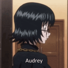 a close up of a girl with the name audrey on the bottom