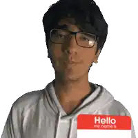 a man wearing glasses is holding a hello my name is tag in front of his face
