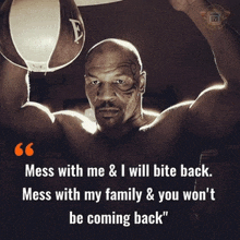 mike tyson holds a punching bag over his head with a quote about mess with me and i will bite back