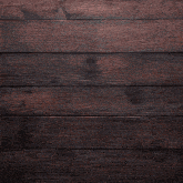 a wooden surface with a picture of a person in a frame on it