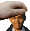 a close up of a person 's head with a hand holding it over it .