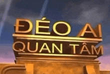 a sign that says " deo ai quan tam " on top of a building