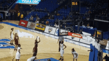 a basketball game is underway with a scoreboard that says tssaa.org on it
