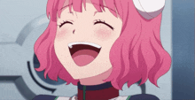 a girl with pink hair is smiling with her mouth open