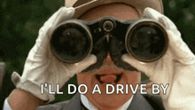 a man in a suit and hat is looking through binoculars and making a face .