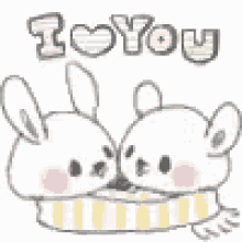 a couple of rabbits sitting next to each other with the words `` i love you '' written on it .